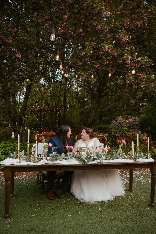 spring garden wedding head table with pink florals