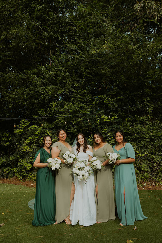 bride with shades of green bridesmaids