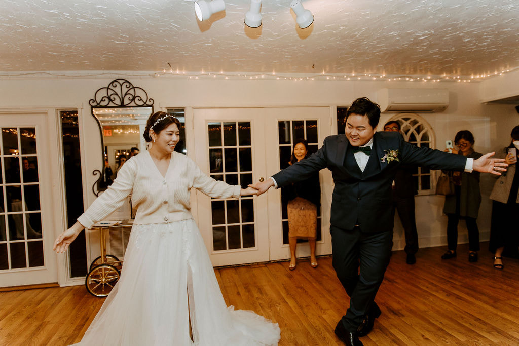 bride and groom's first dance in carriage house