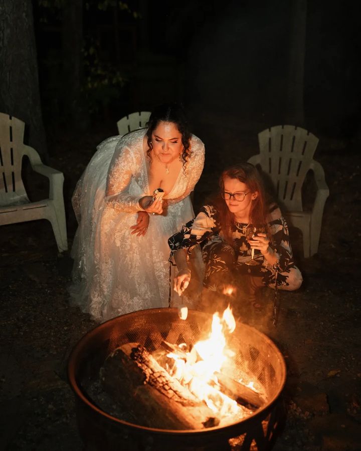 Bride enjoying smores by the firepit at north Georgia garden wedding venue