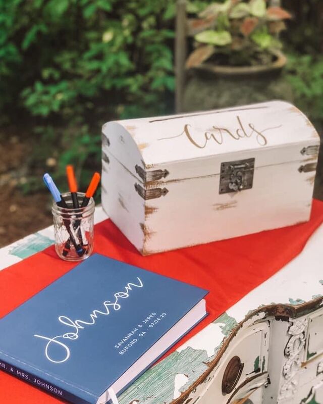 red, white, and blue guest book table