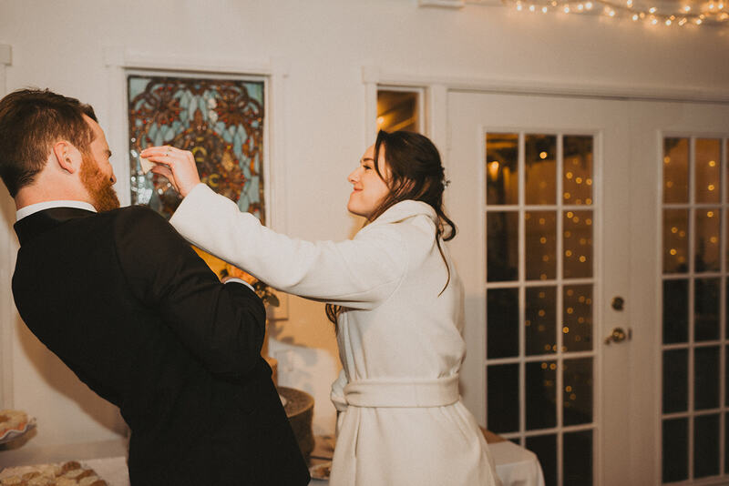 bride shoving cake in groom's face