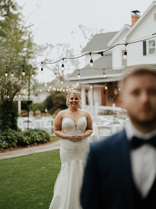 bride behind groom for first look