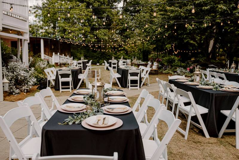 garden wedding reception with black, pink, and gold details