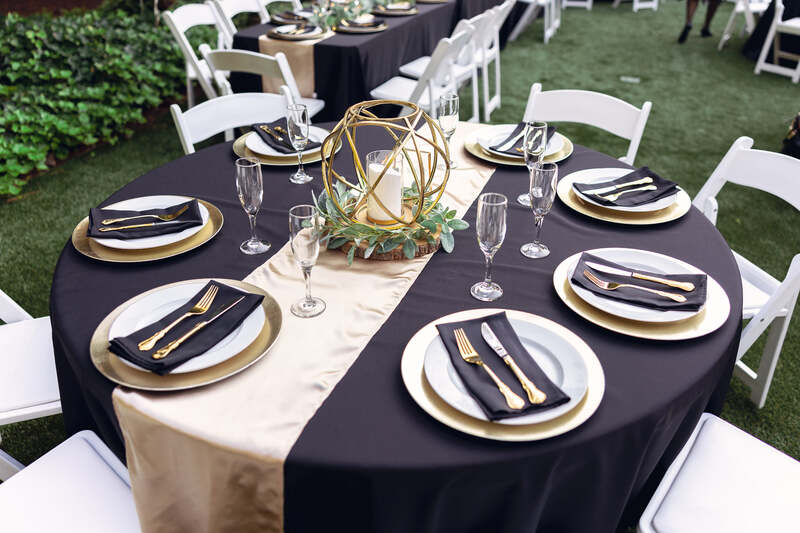 black and champagne reception table
