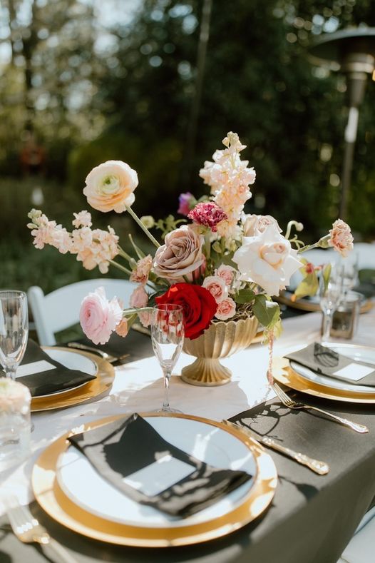 modern floral centerpiece in gold bowl at garden reception