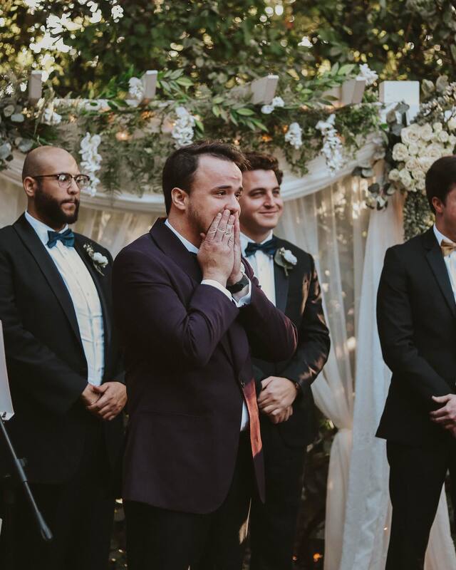 groom reacting to bride's entrance during ceremony processional