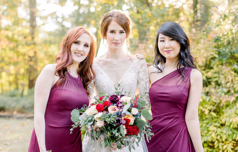 bride with bridesmaids in wine colored dresses