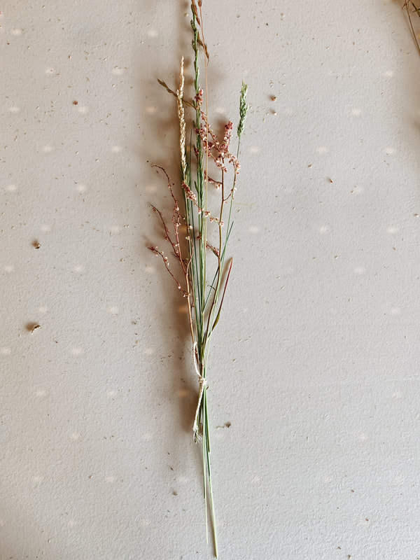 small bunch of wildflowers tied with twine