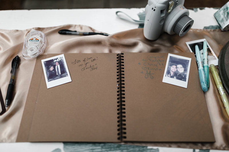 guest book with polaroid photos and messages from guests