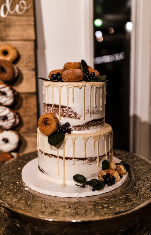 2-tier cake decorated with donuts