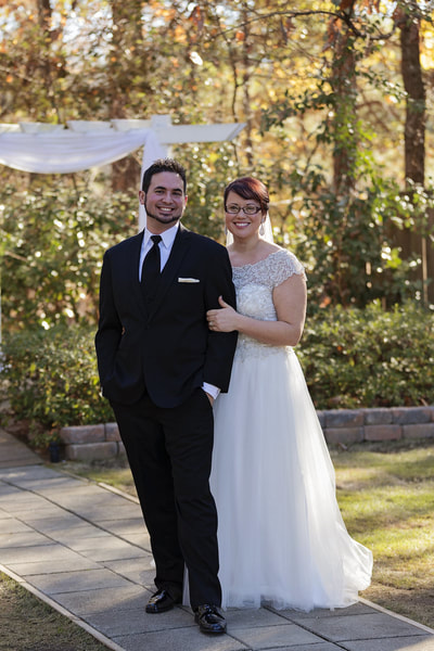 Picture of Whitney and Jose by the outdoor altar for their winter wedding.