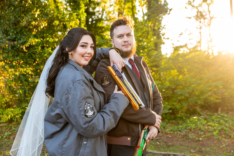 november wedding couple posing with Dungeons & Dragons attire during portraits