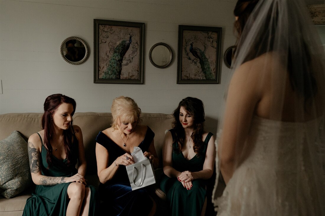 bride giving gift to mother-in-law