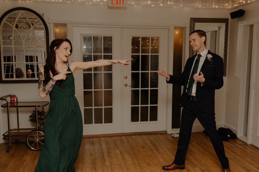 groom dancing with sister