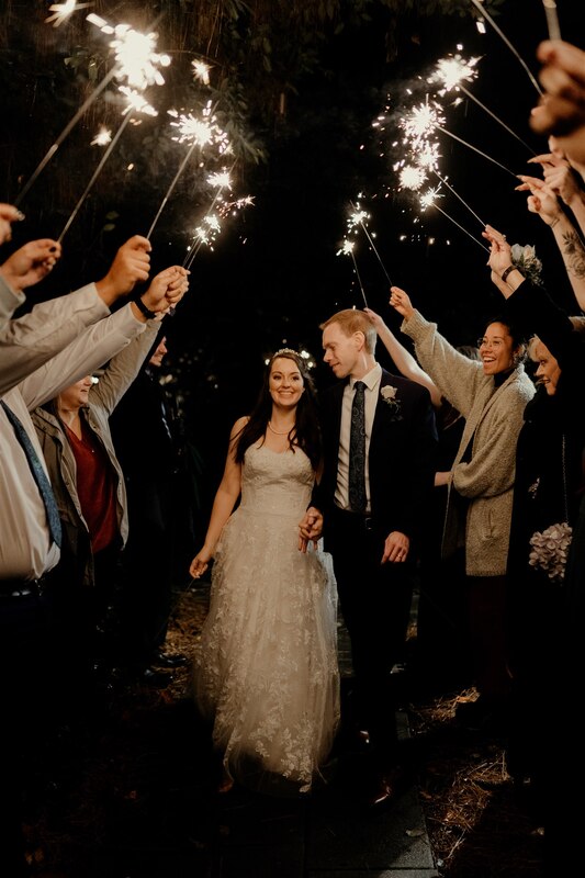 newlyweds during sparkler grand exit