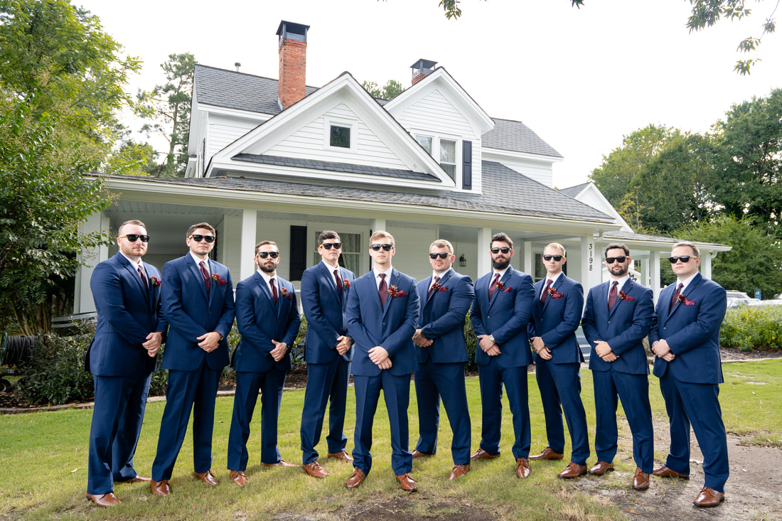 groom and groomsmen wearing sunglasses