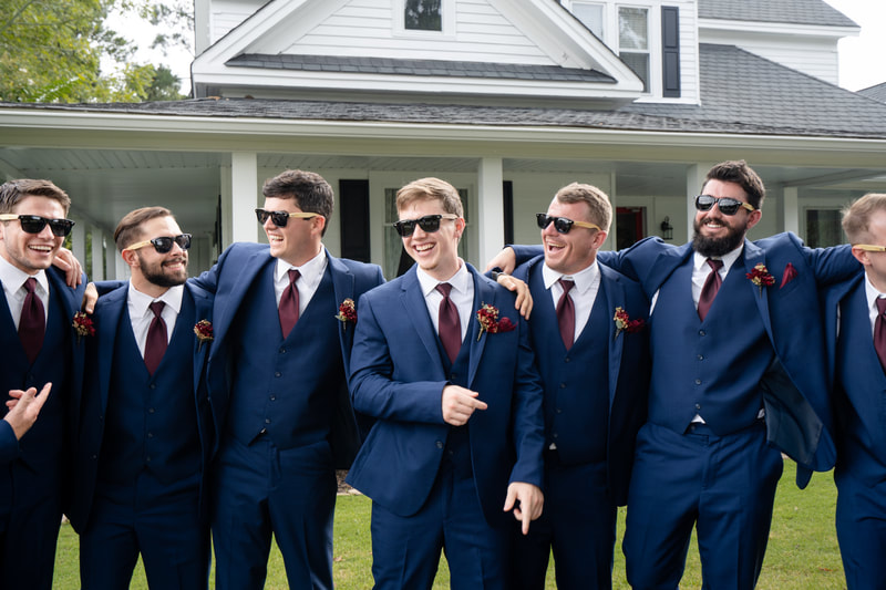 groomsmen in matching sunglasses