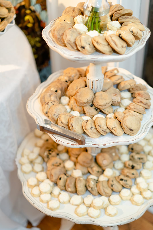 different types of cookies arranged on tiered stand
