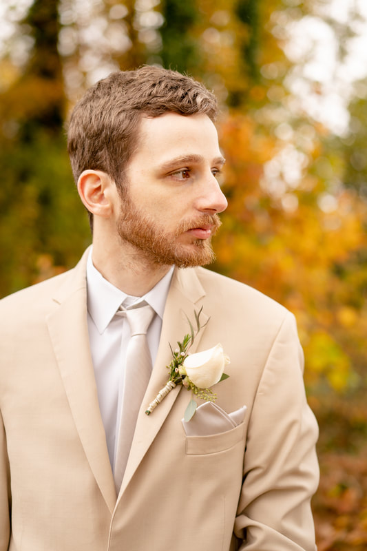 groom in neutral suit