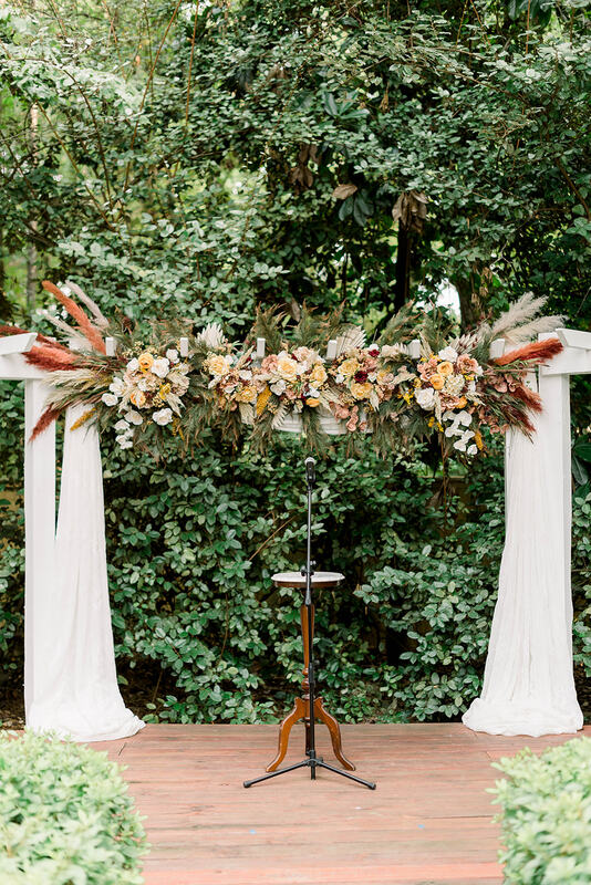 boho-inspired outdoor ceremony altar