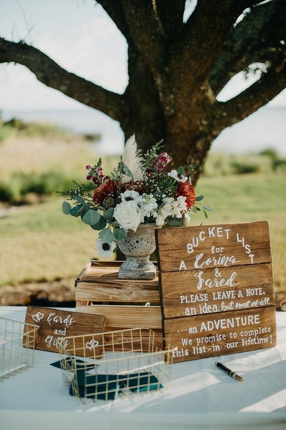 rustic guest book table with bucket list