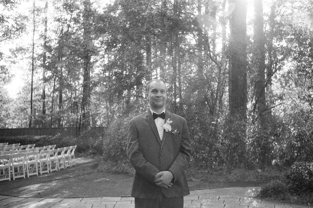 black and white film photo of groom