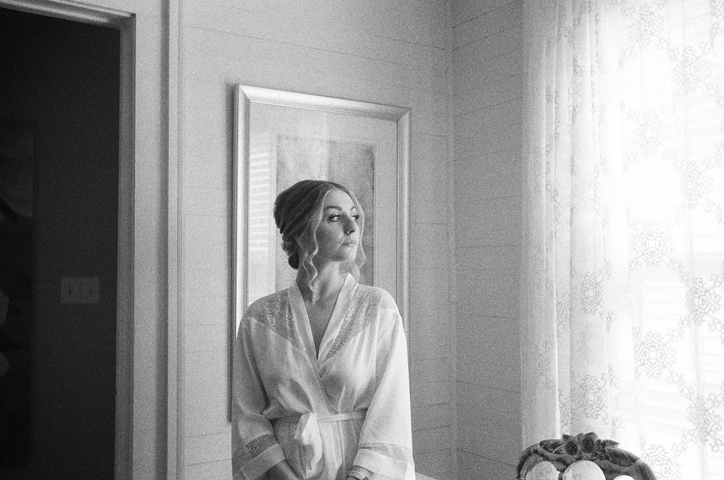 black and white film of bride in robe