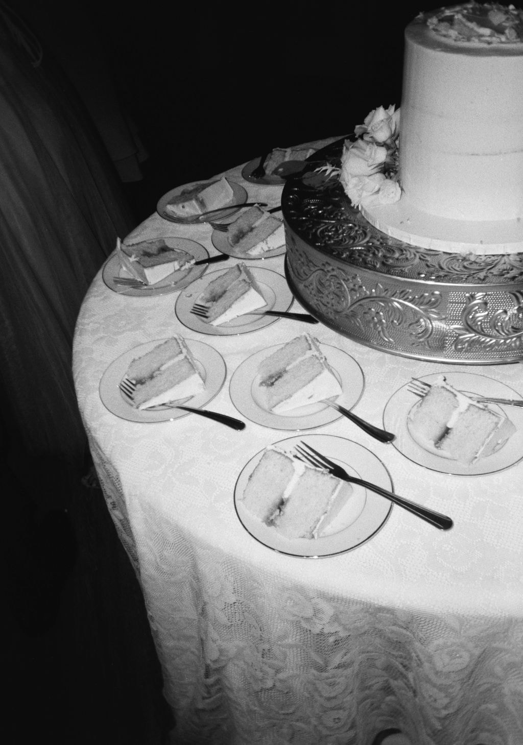 black and white film of wedding cake slices