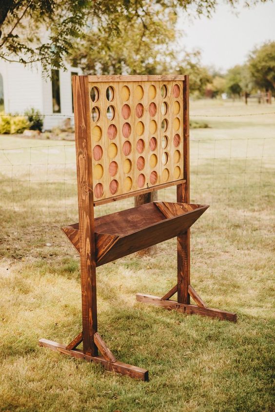giant connect four made from wood at outdoor farm yard