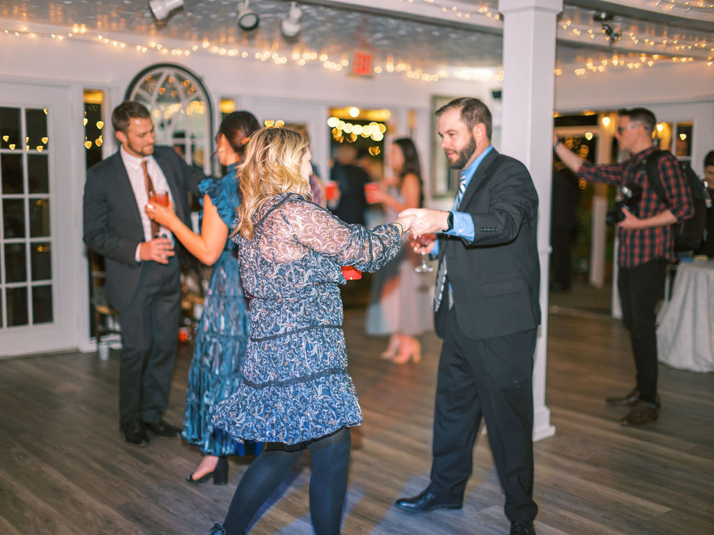guests dancing at farmhouse reception