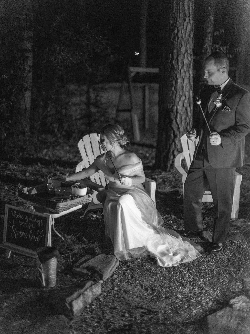 bride and groom getting smores materials