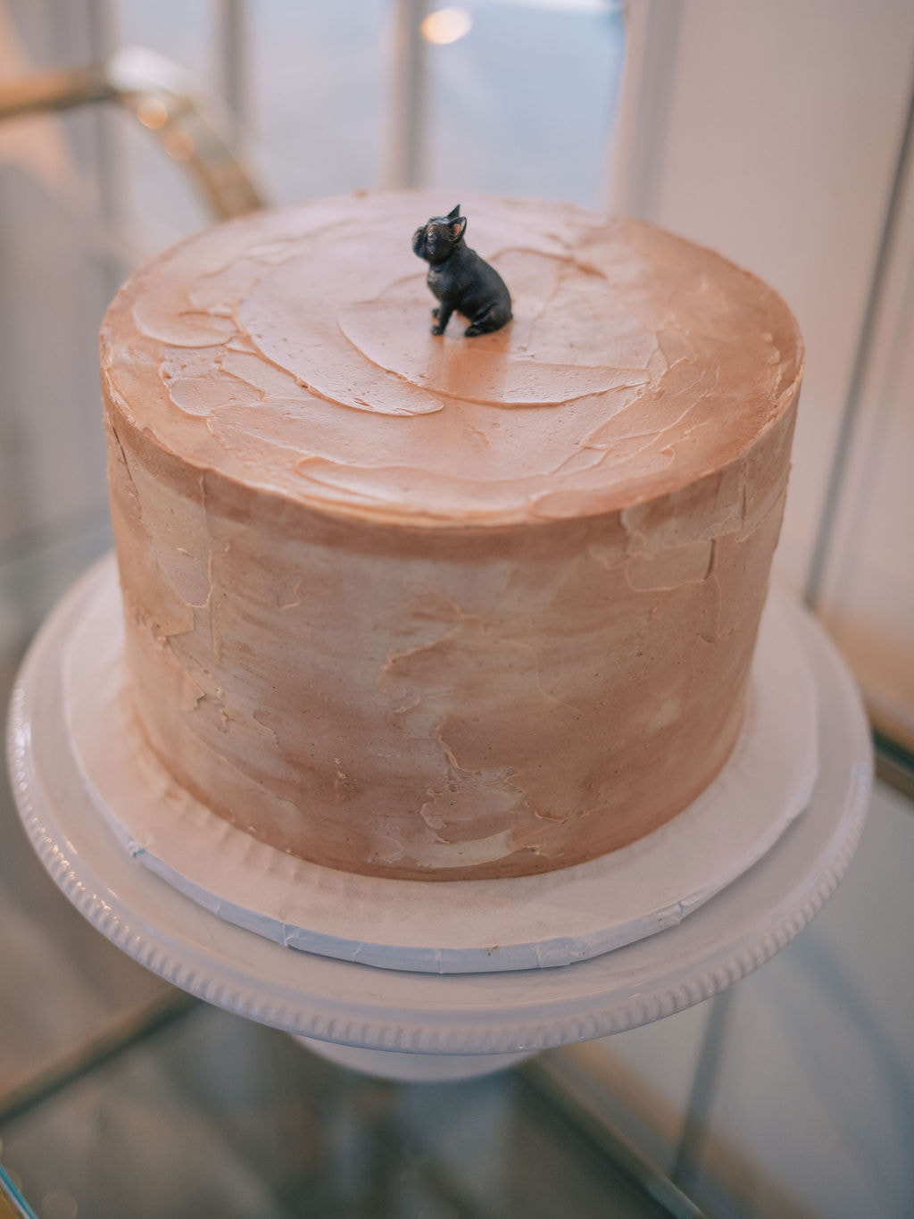 chocolate groom's cake with mini french bulldog topper