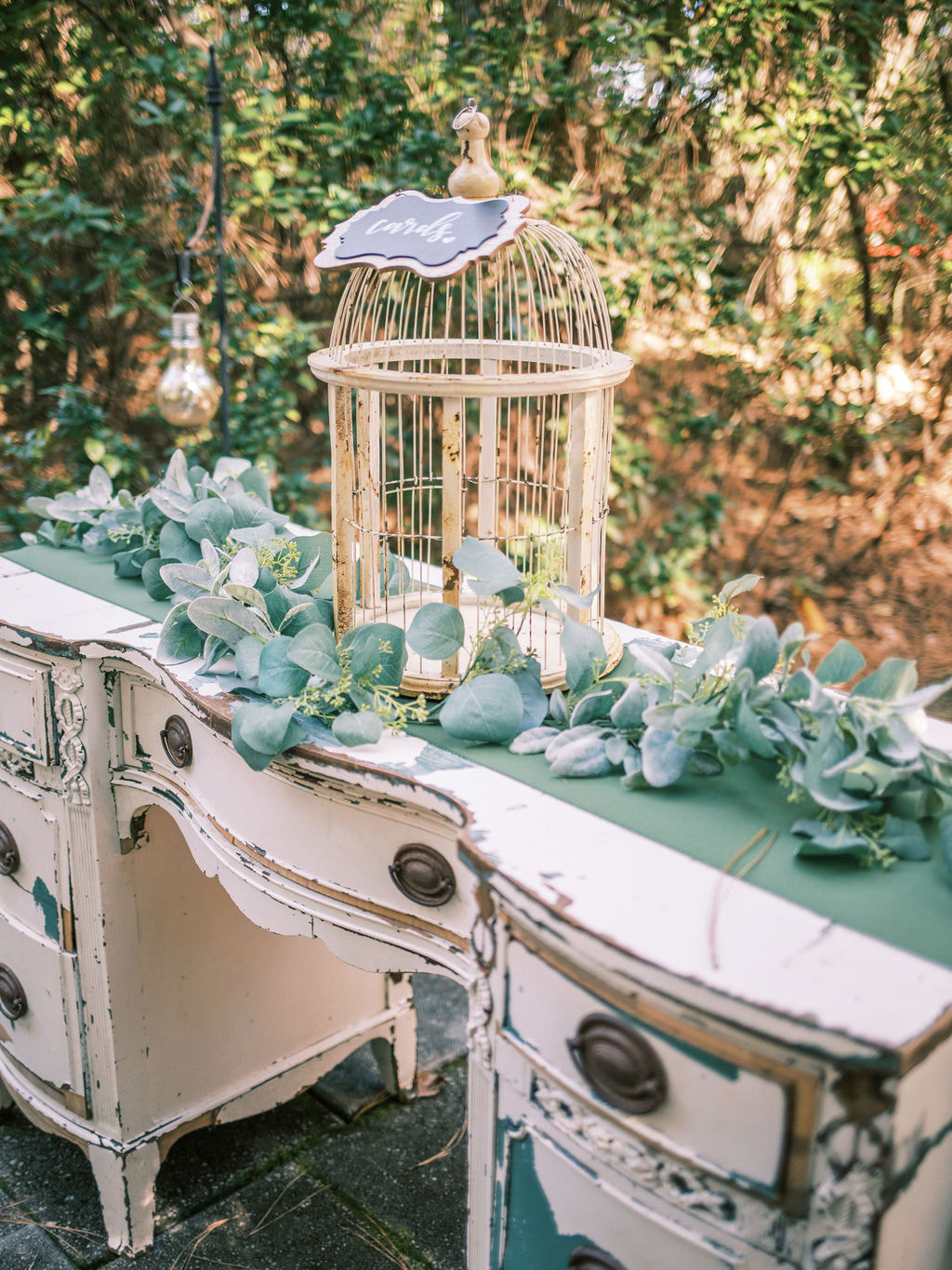 distressed welcome desk with bird cage for cards