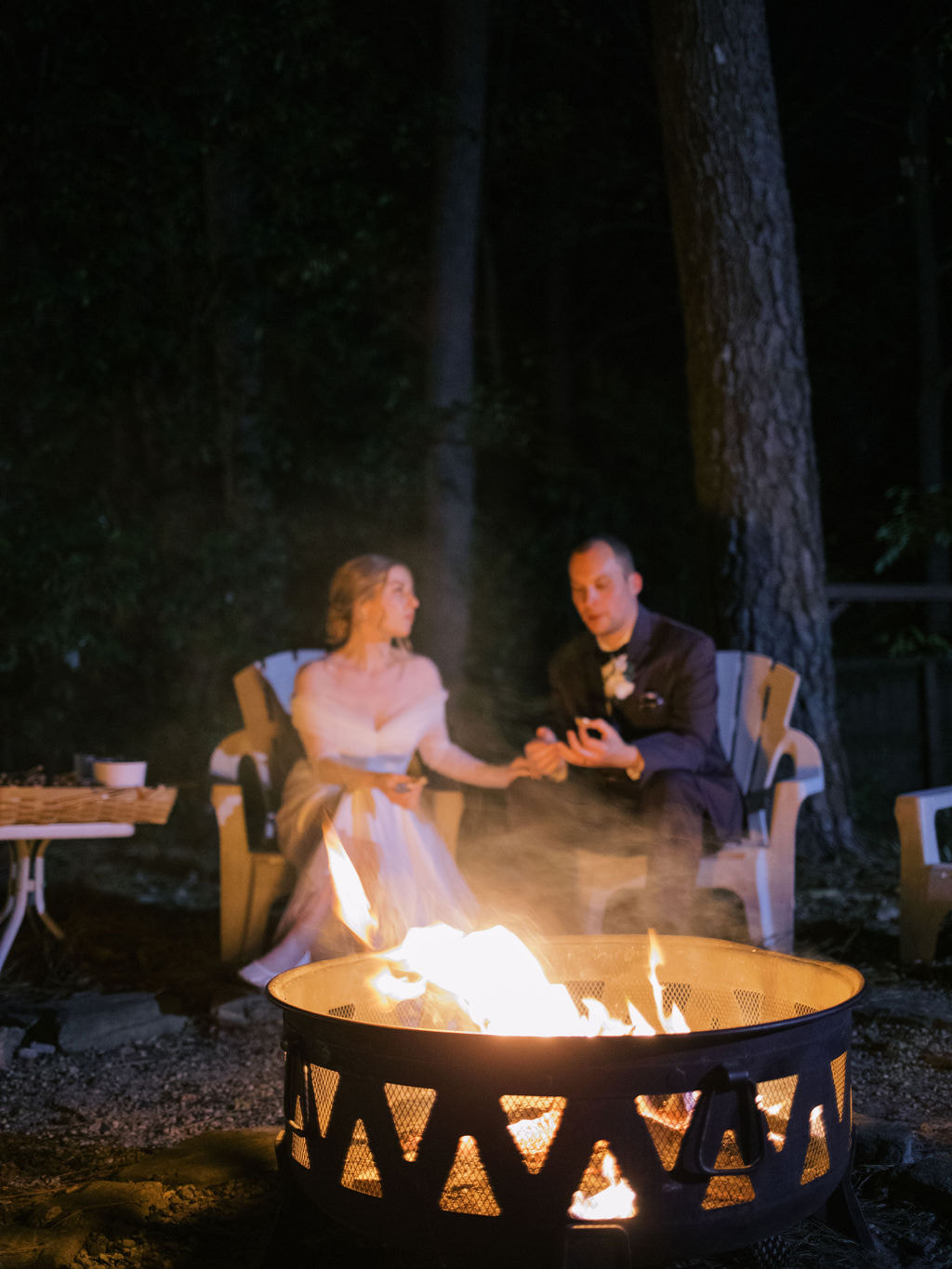 bride and groom at fire pit