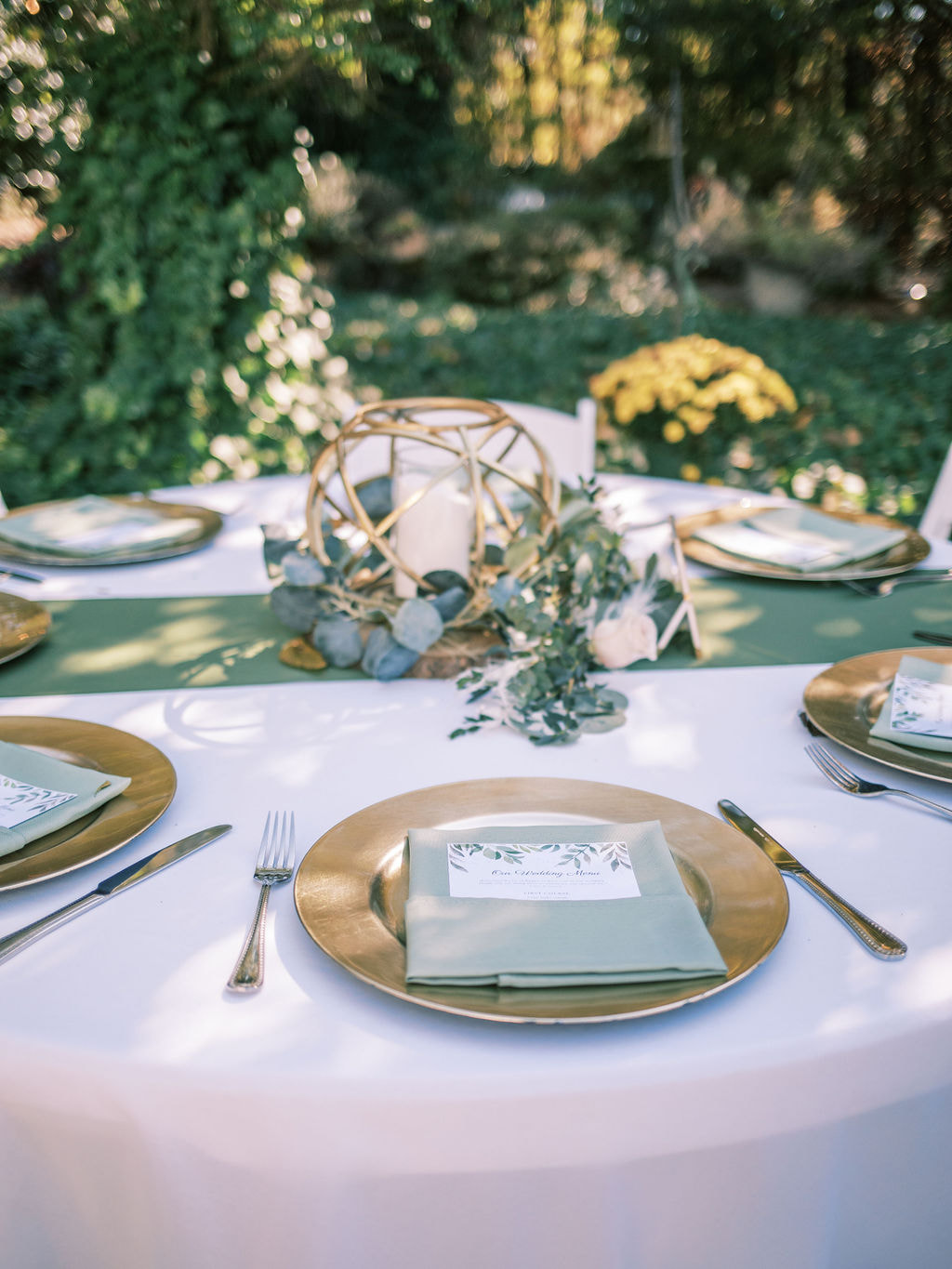 sage, eucalyptus, and gold wedding tables