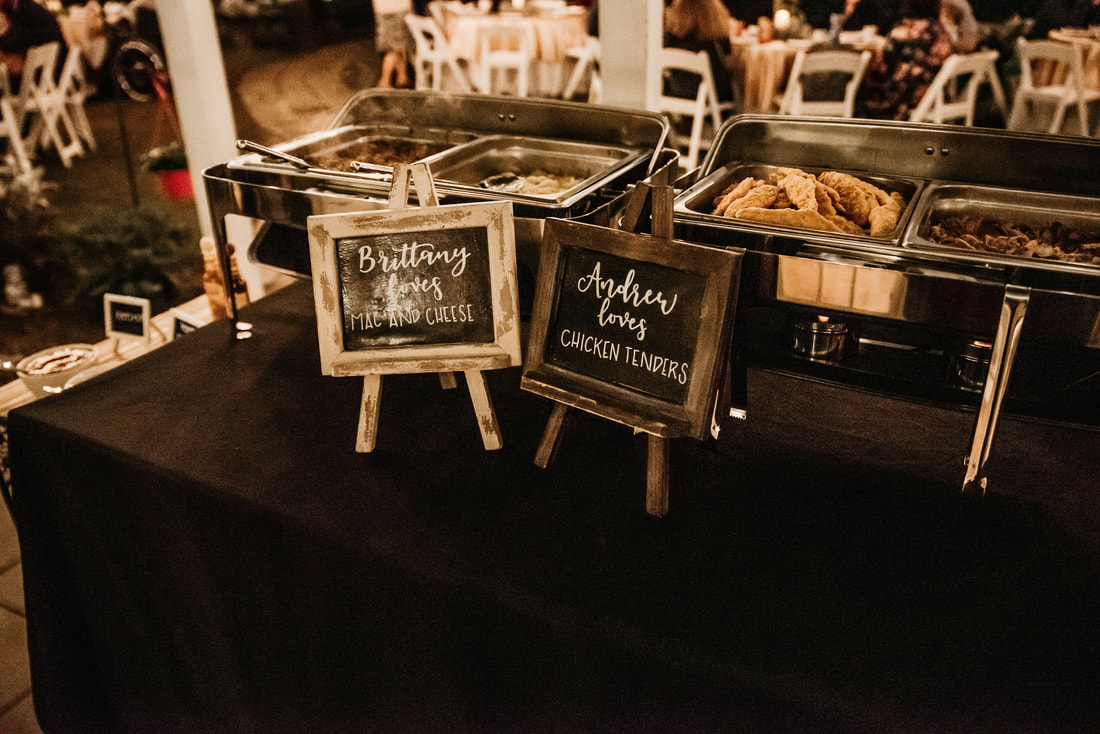 reception buffet with mac n cheese and chicken tenders and mini chalkboard signs