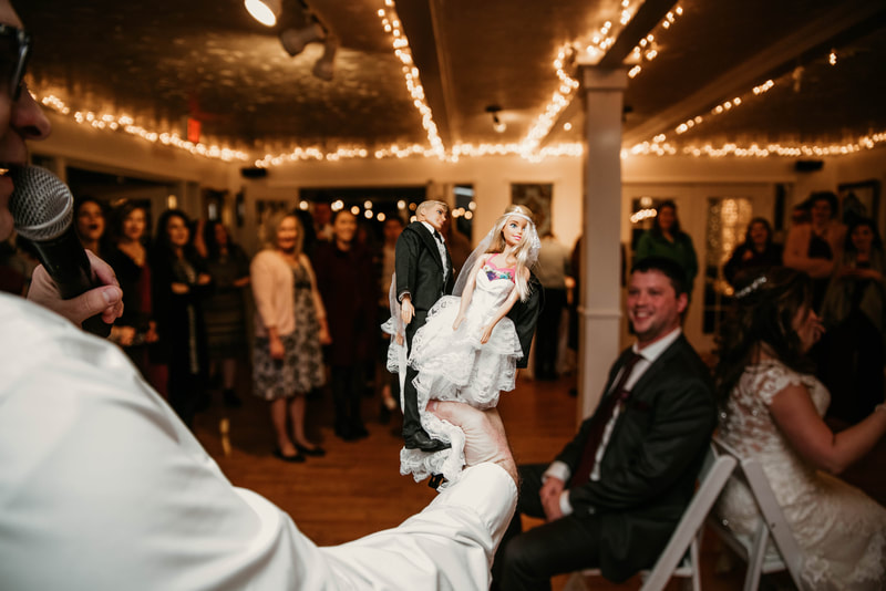 bride and groom dolls for newlywed game during reception