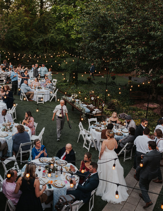 secret garden wedding reception under bistro lights
