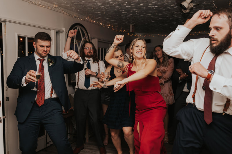 wedding guests dancing in ballroom
