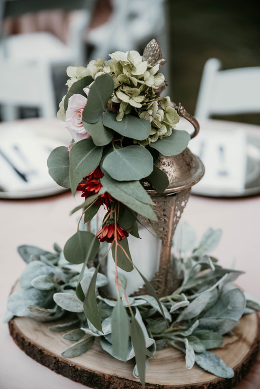 antique golden lanterns with lambs ear greenery, eucalyptus leaves, and florals