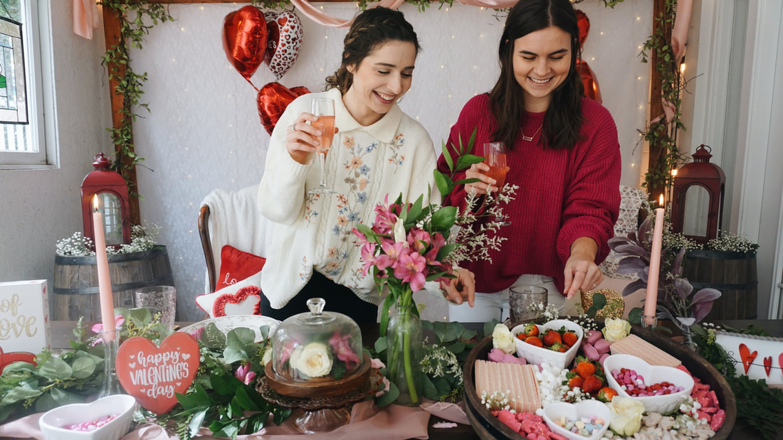 valentine's day tablescape with sweets charcuterie board and 2 coordinators