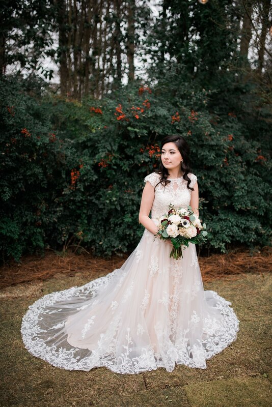 bride standing in Four Oaks' gardens