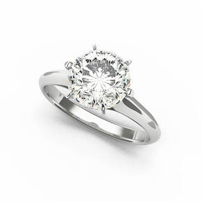 Silver engagement ring with round diamond.