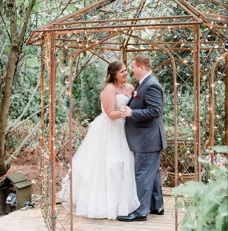 Picture of Madison and Michael dancing in our gazebo surrounded with fairy lights.