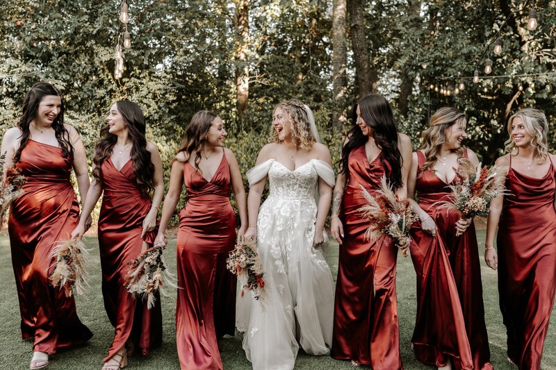 Bridesmaids walking and laughing photo