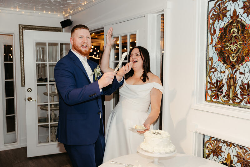 cake cutting at farmhouse with stained glass windows