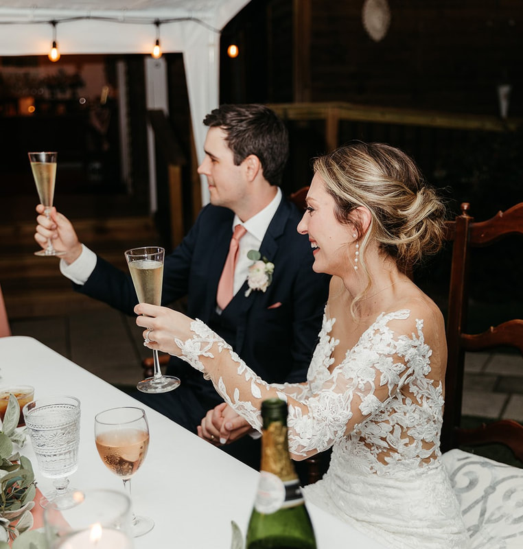 Bride & groom toasting to the beginning of a new adventure