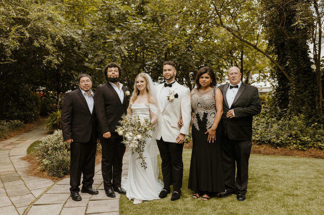 newlyweds with groom's family