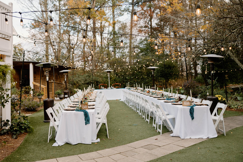 banquet-style tables at backyard venue